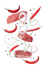 Beef meat and different spices falling on white background