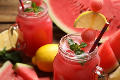 Photo of Delicious fresh watermelon drink in mason jars, closeup