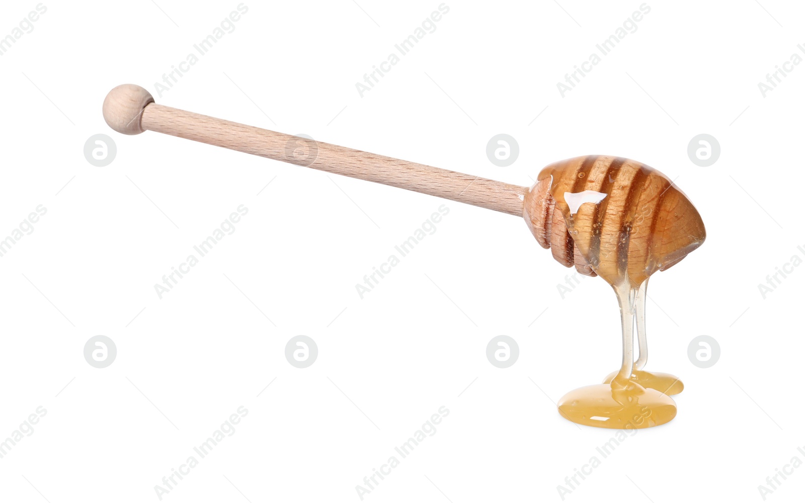 Photo of Natural honey dripping from dipper on white background