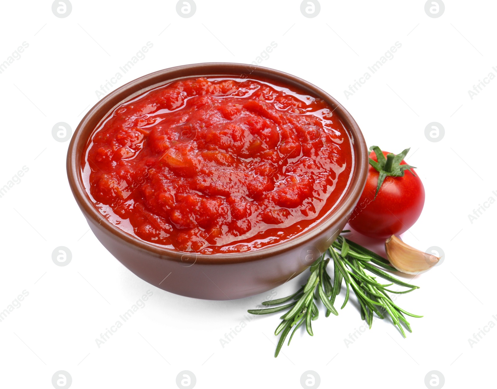 Photo of Homemade tomato sauce in bowl and fresh ingredients isolated on white