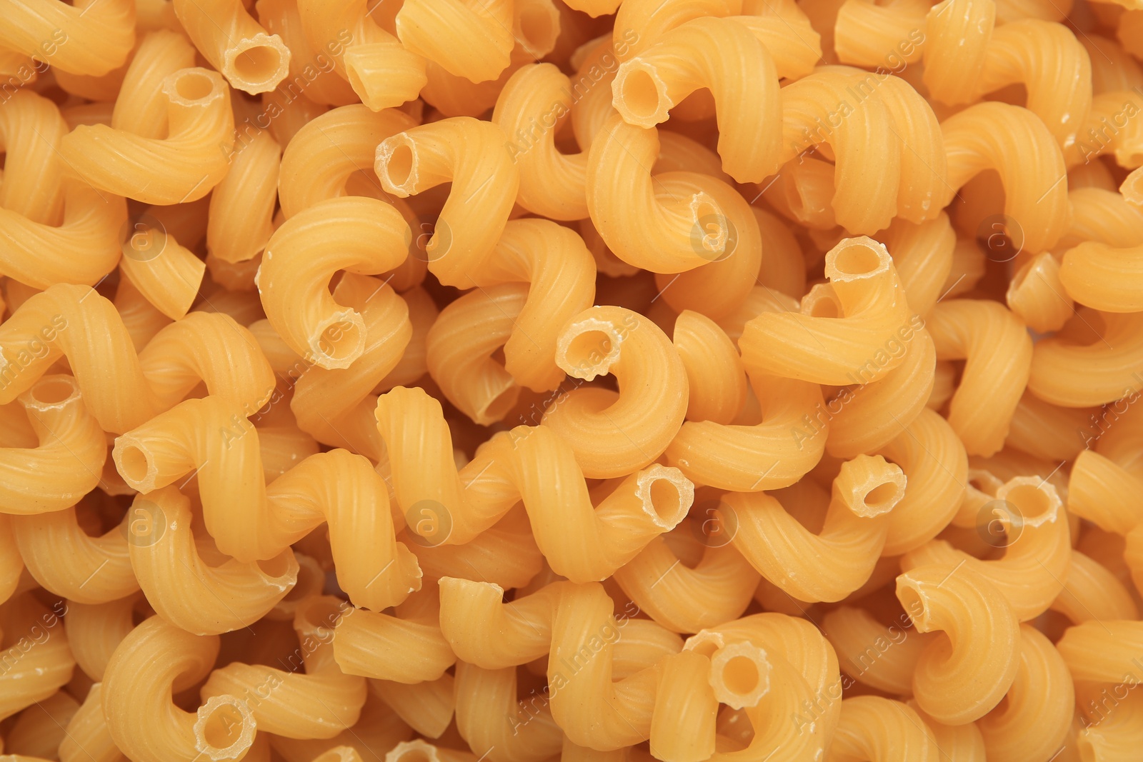 Photo of Raw cavatappi pasta as background, top view