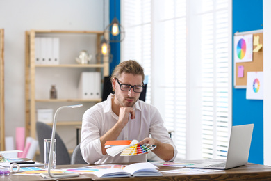 Photo of Professional interior designer at workplace in office