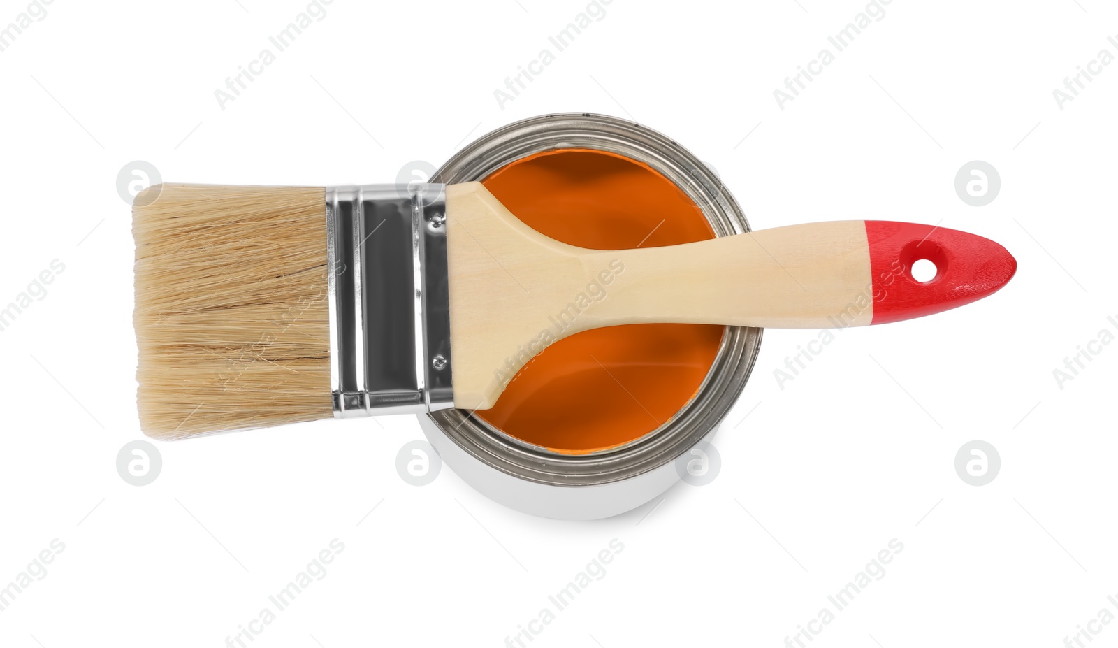 Photo of Can of orange paint and brush on white background, top view