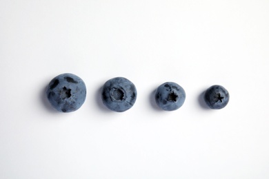 Flat lay composition with tasty blueberry on white background