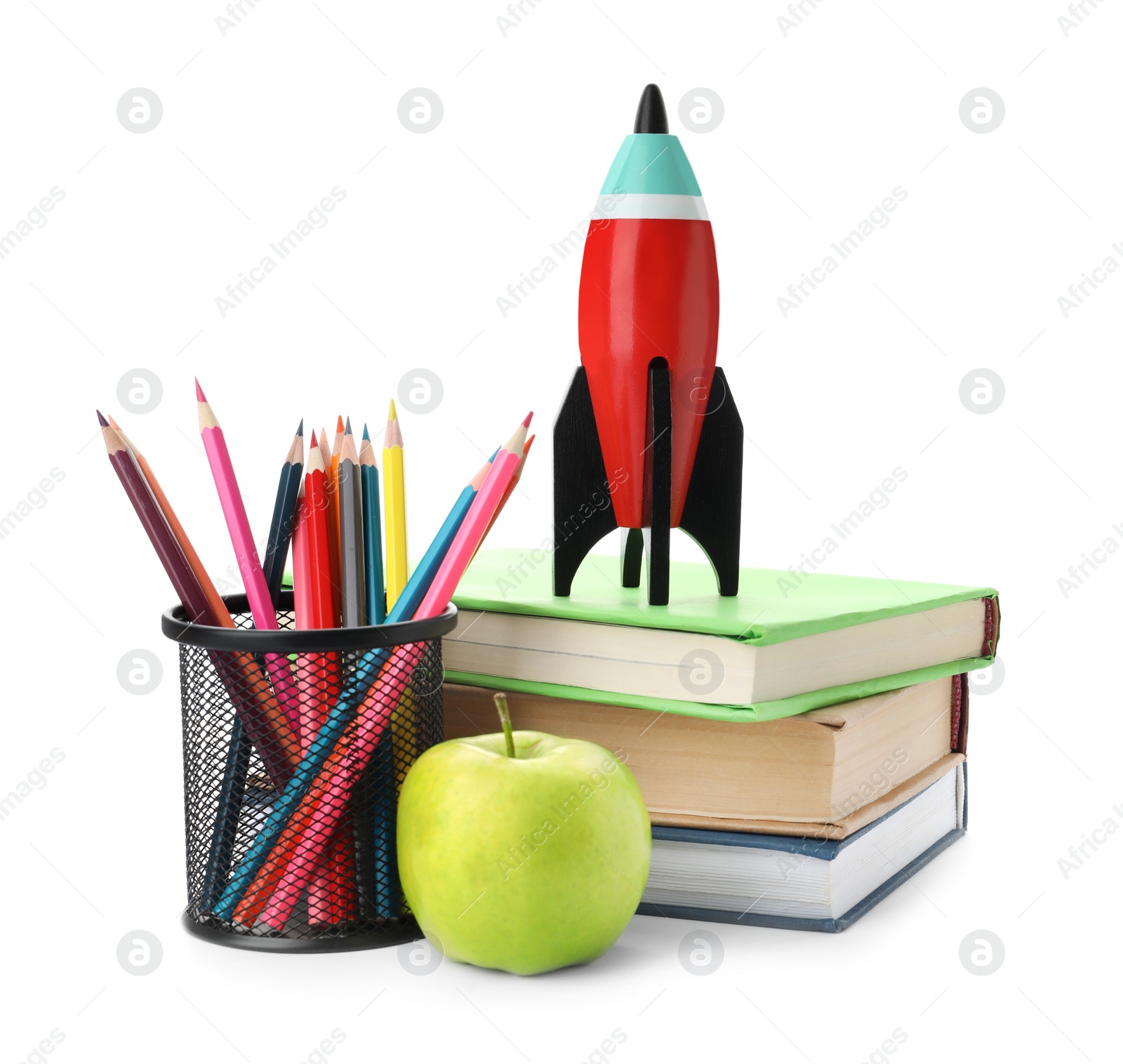 Photo of Bright toy rocket and school supplies on white background