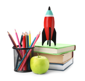 Bright toy rocket and school supplies on white background