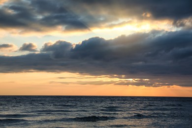 Photo of Picturesque view of beautiful sky with clouds over sea at sunset