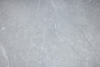 Texture of light grey marble surface as background, closeup