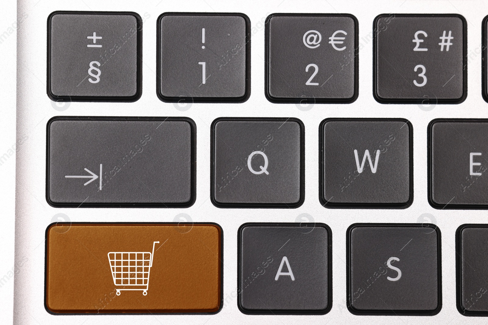 Image of Internet store. Brown button with shopping cart on computer keyboard, top view