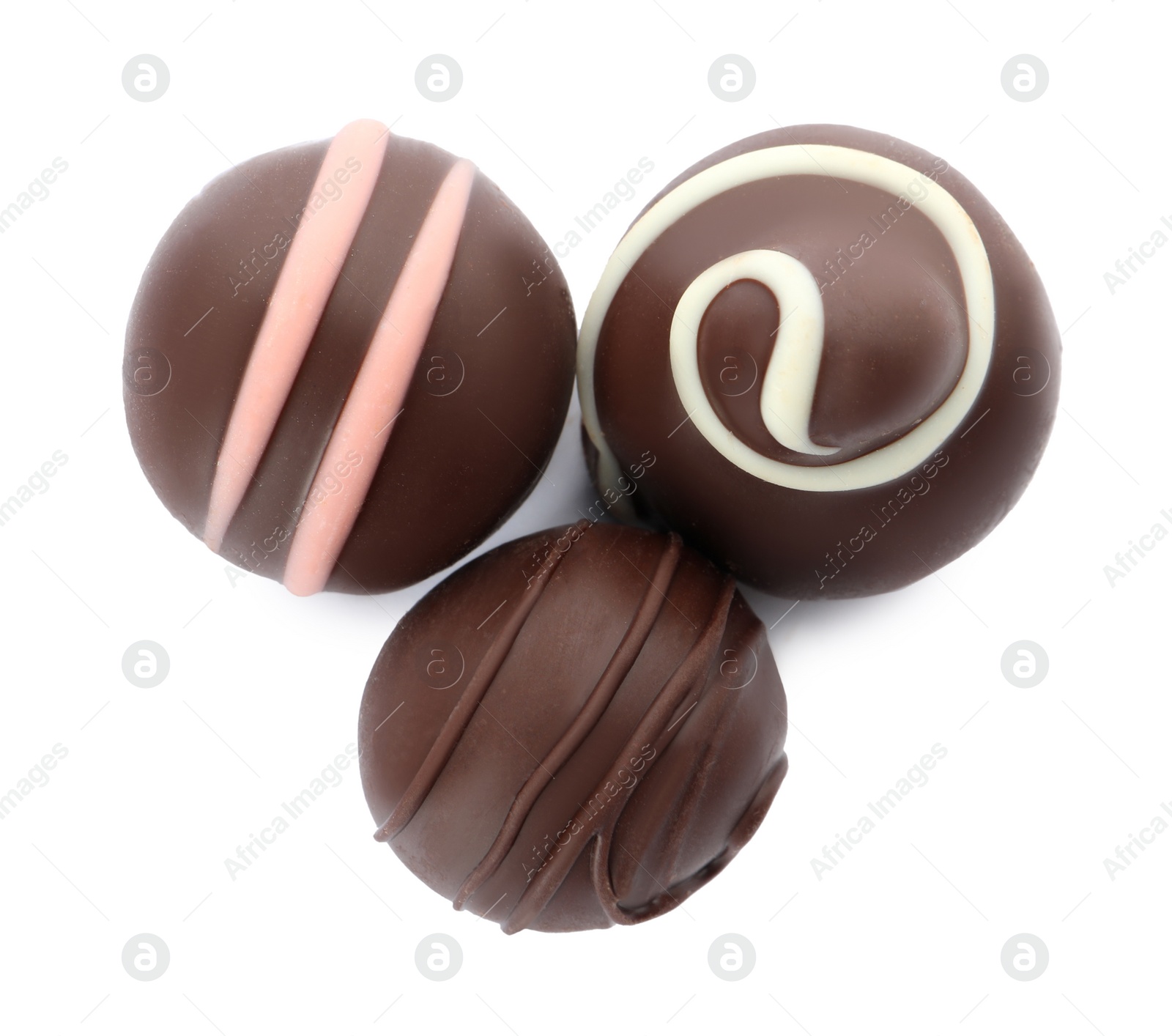 Photo of Many different delicious chocolate truffles on white background, top view