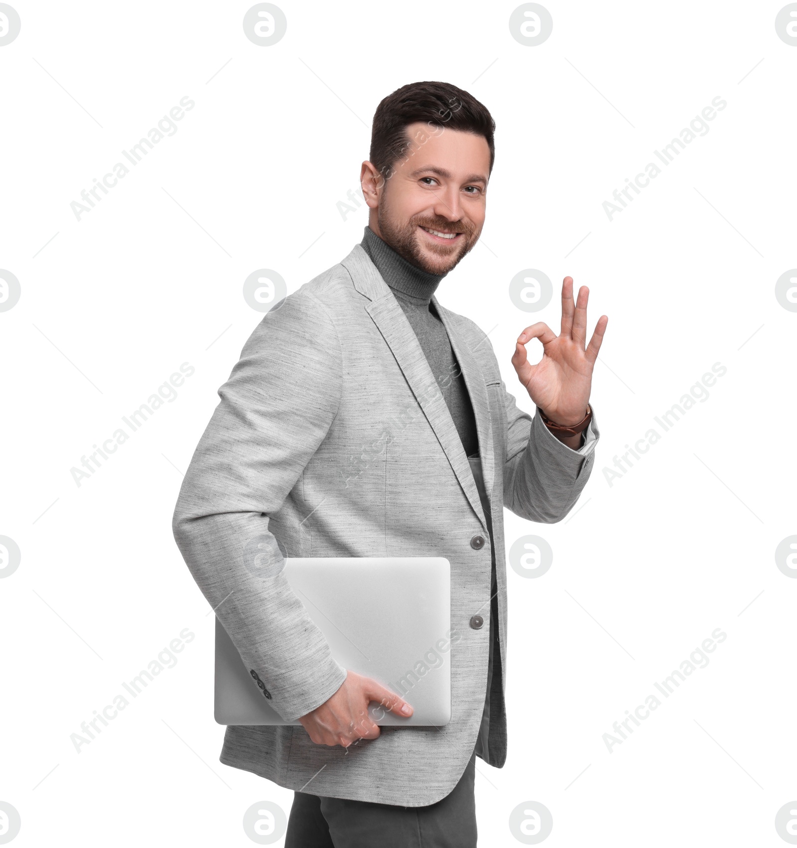 Photo of Handsome bearded businessman with tablet showing OK gesture on white background