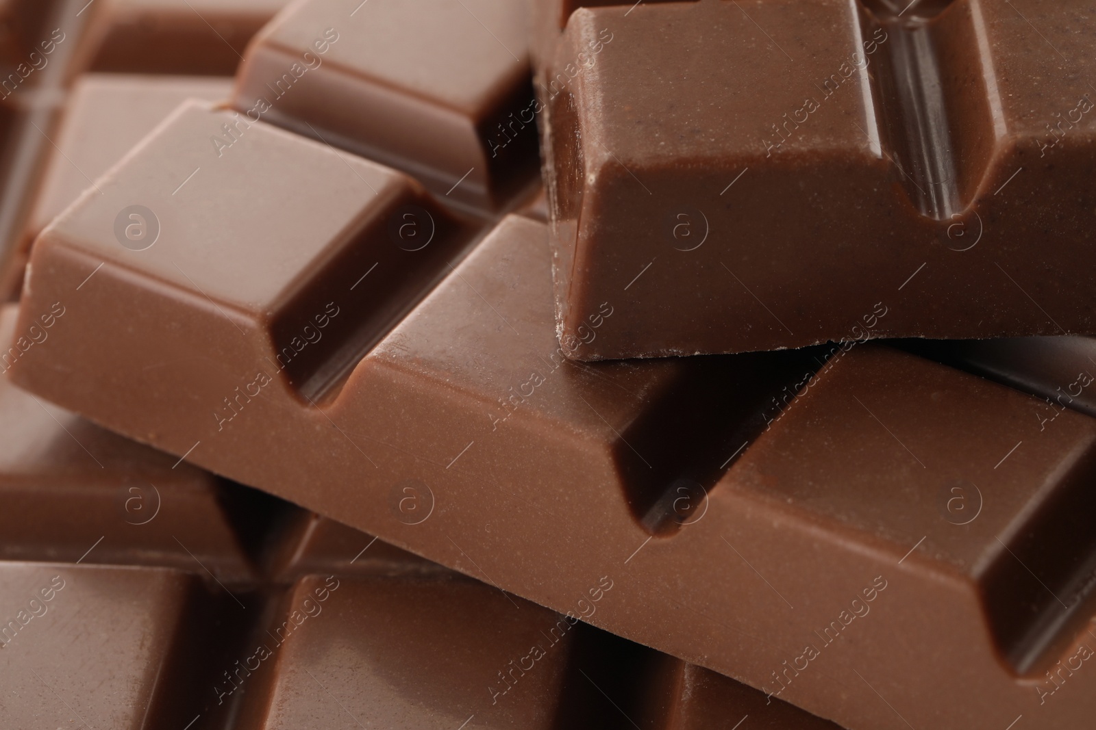 Photo of Delicious milk chocolate as background, closeup view