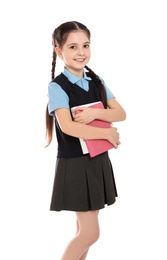 Photo of Portrait of cute girl in school uniform with books on white background