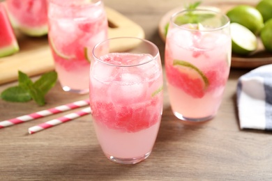 Photo of Delicious refreshing watermelon drink on wooden table