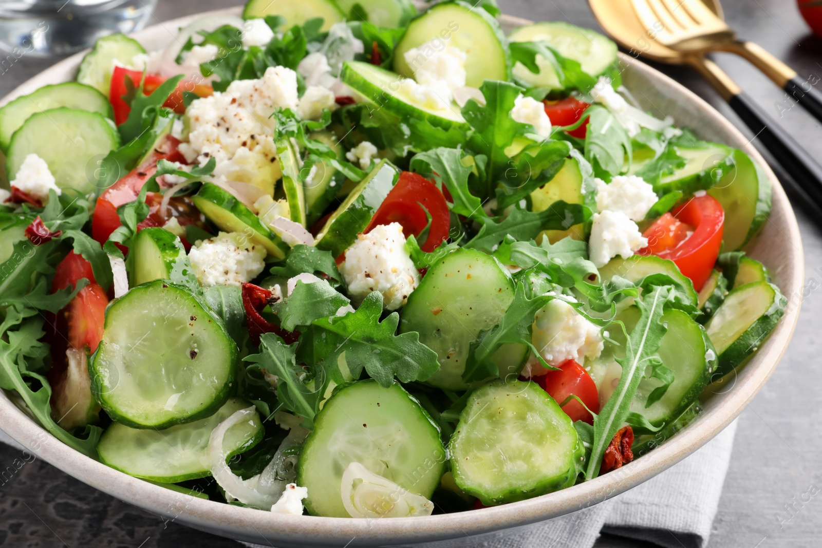 Photo of Plate of delicious cucumber salad on table, closeup