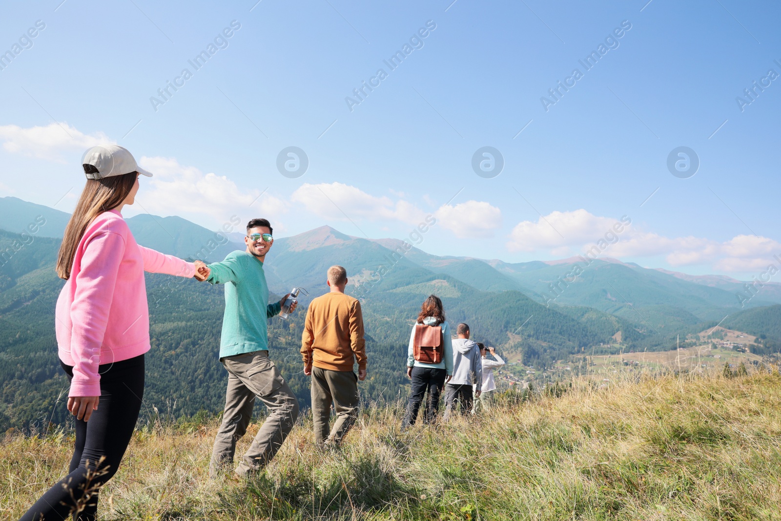 Photo of Group of people spending time together in mountains