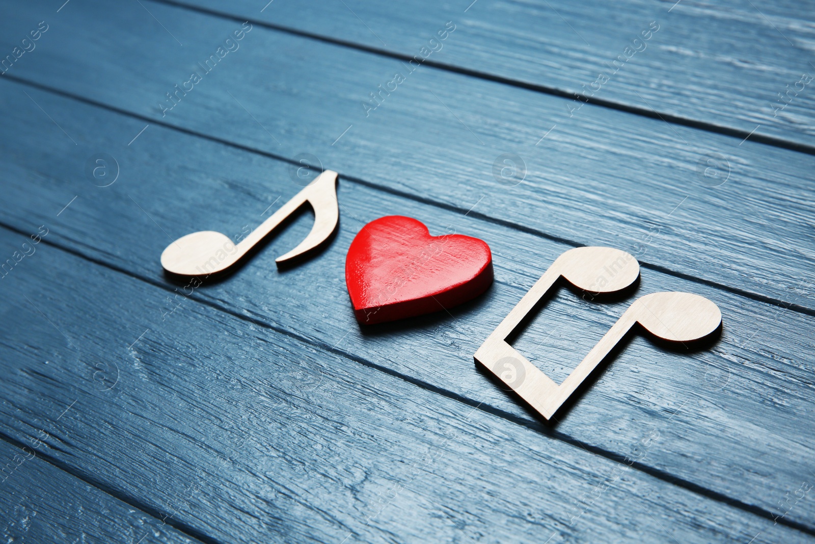 Photo of Composition with wooden notes and heart on color background