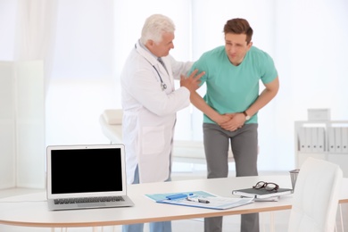 Photo of Man with health problems visiting urologist at hospital