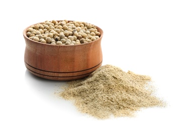 Photo of Wooden bowl with pepper grains and powder on white background