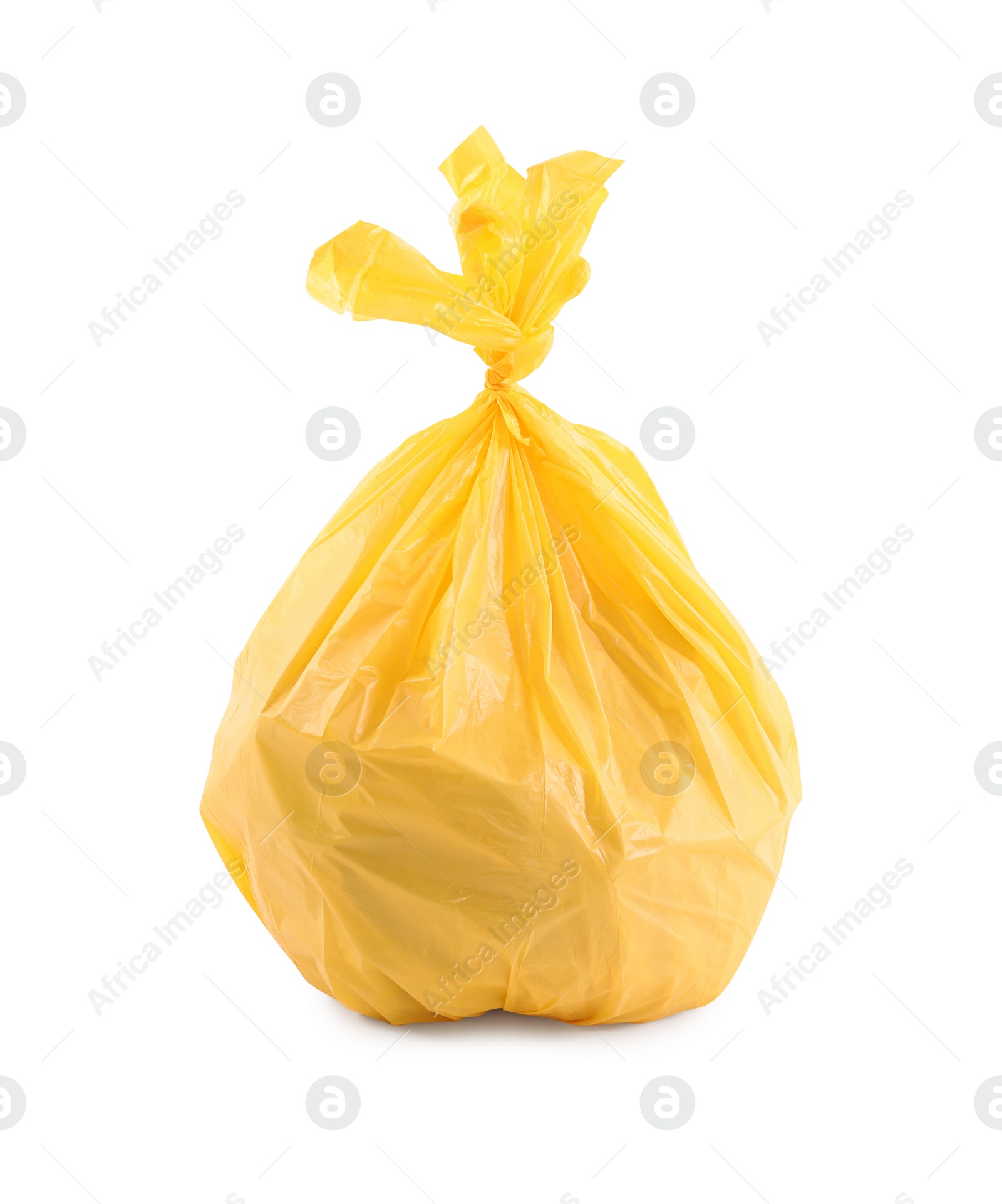 Photo of Yellow plastic garbage bag isolated on white