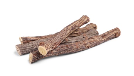 Photo of Dried sticks of liquorice root on white background