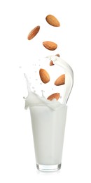 Image of Delicious almond milk and nuts on white background