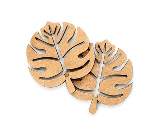 Photo of Leaf shaped wooden cup coasters on white background, top view