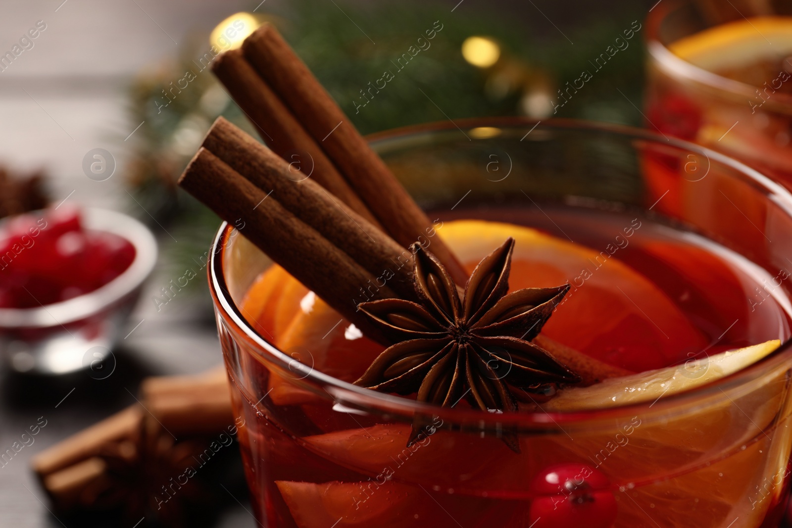 Photo of Glass with delicious punch drink on table, closeup