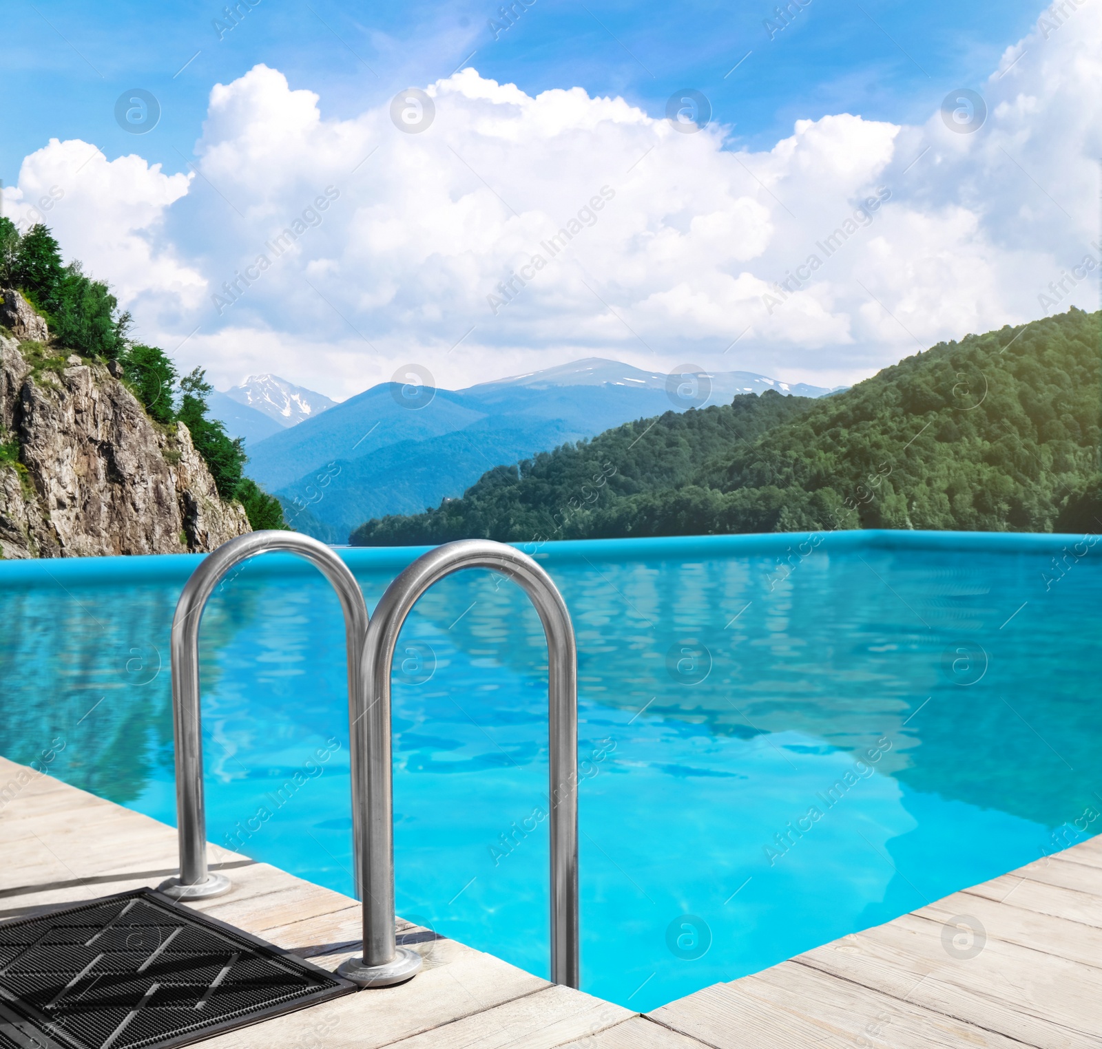 Image of Outdoor swimming pool at luxury resort and beautiful view of mountains on sunny day