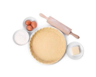 Photo of Quiche pan with fresh dough, rolling pin and ingredients isolated on white, top view