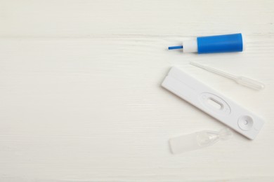 Photo of Disposable express hepatitis test kit on white wooden table, flat lay. Space for text