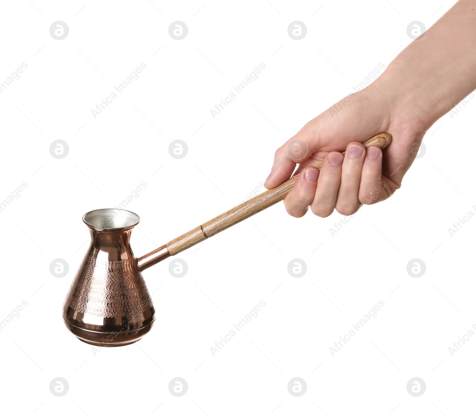 Photo of Woman holding copper turkish coffee pot on white background, closeup