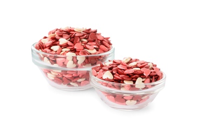 Bright heart shaped sprinkles in glass bowls on white background