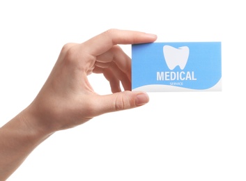 Woman holding business card isolated on white, closeup. Dental medical service