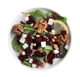 Delicious beet salad with feta cheese and walnuts in bowl isolated on white, top view