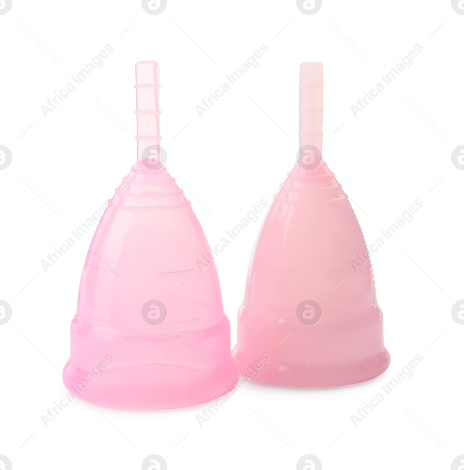 Photo of Two pink menstrual cups on white background