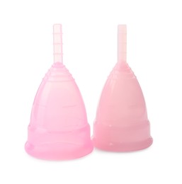 Two pink menstrual cups on white background