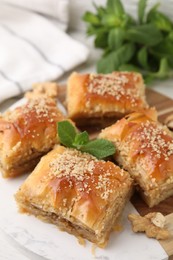 Eastern sweets. Pieces of tasty baklava on table, closeup