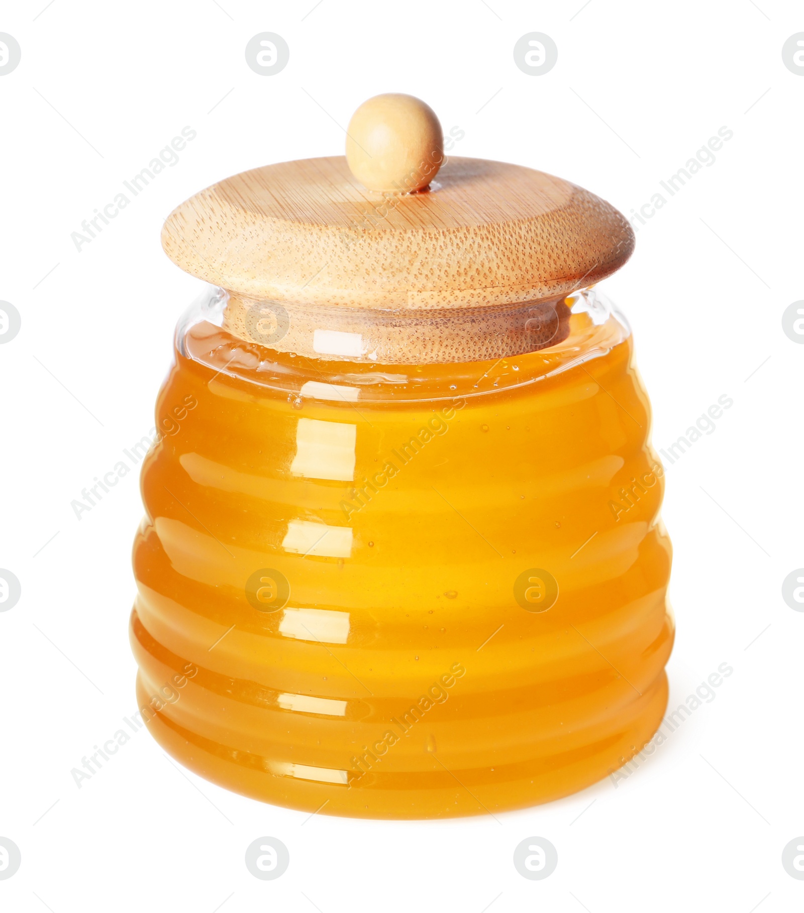 Photo of Tasty natural honey in glass jar isolated on white