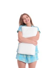 Photo of Young woman in pajamas embracing pillow on white background