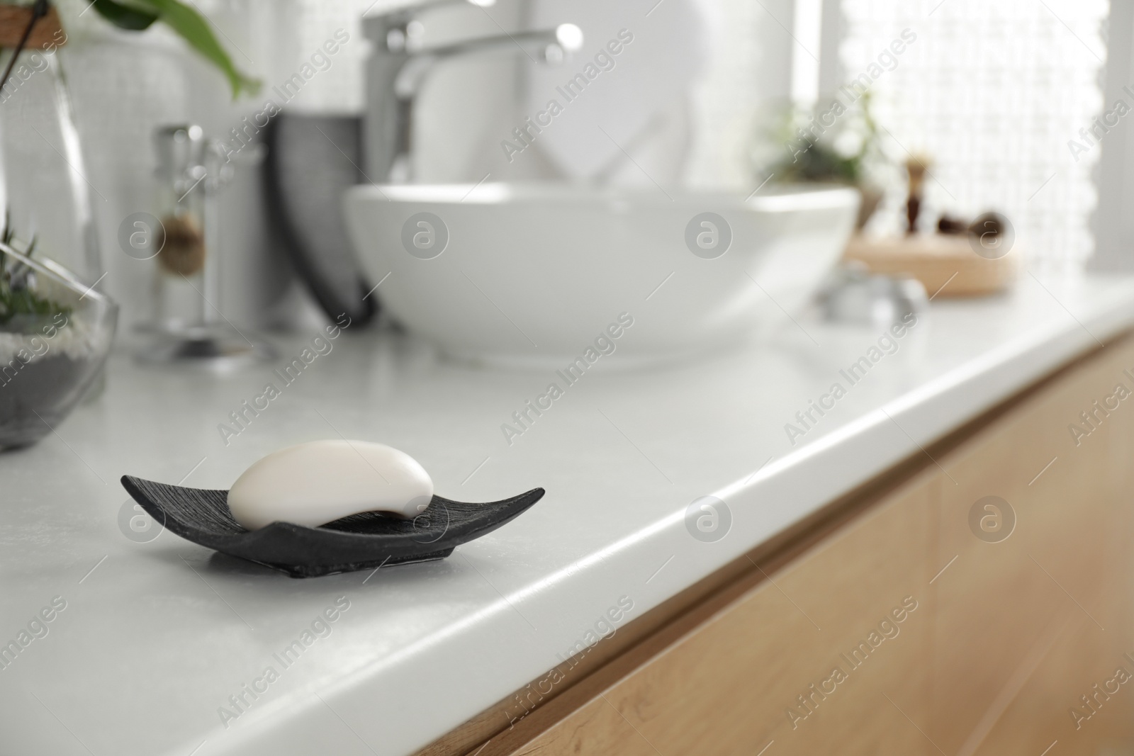 Photo of Soap bar on light countertop in bathroom