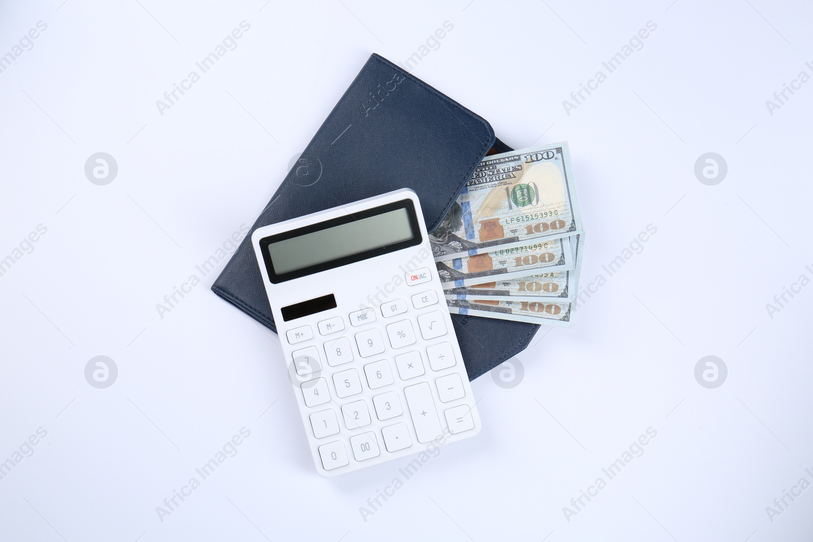 Photo of Calculator, dollar banknotes and wallet on white background, top view. Retirement concept