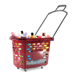 Photo of Shopping basket full of cleaning supplies isolated on white