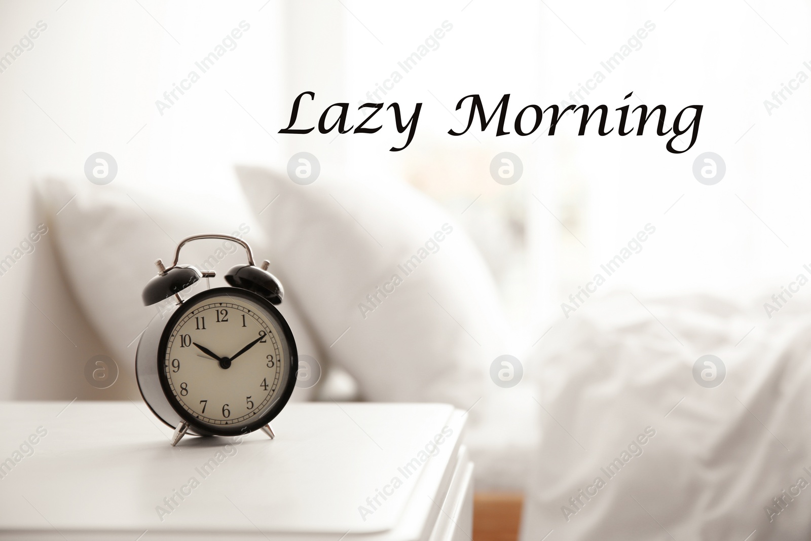 Image of Black alarm clock on nightstand in morning. Lazy morning