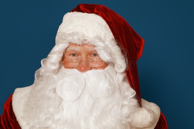 Photo of Happy authentic Santa Claus on blue background