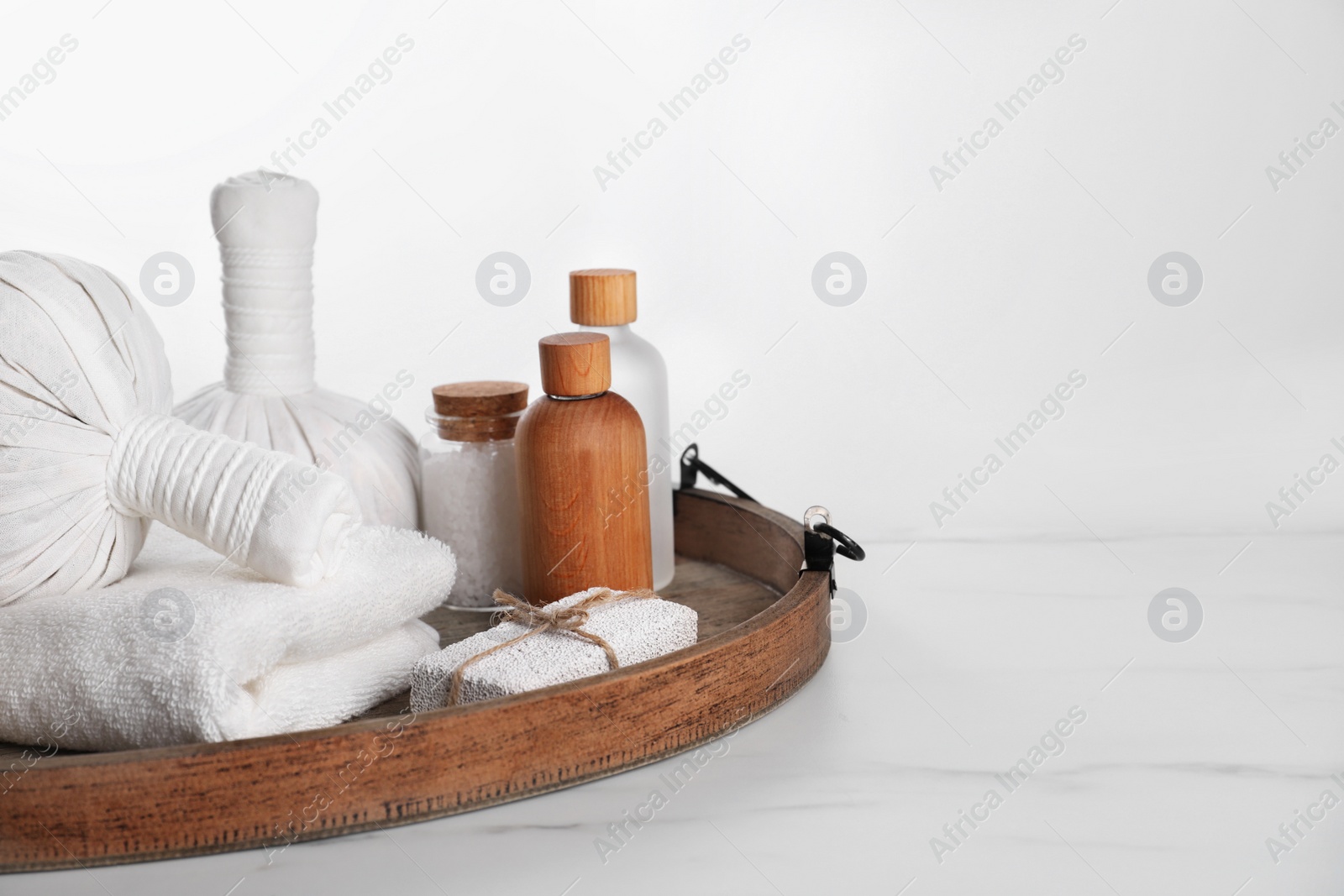 Photo of Spa composition with care products on white marble table