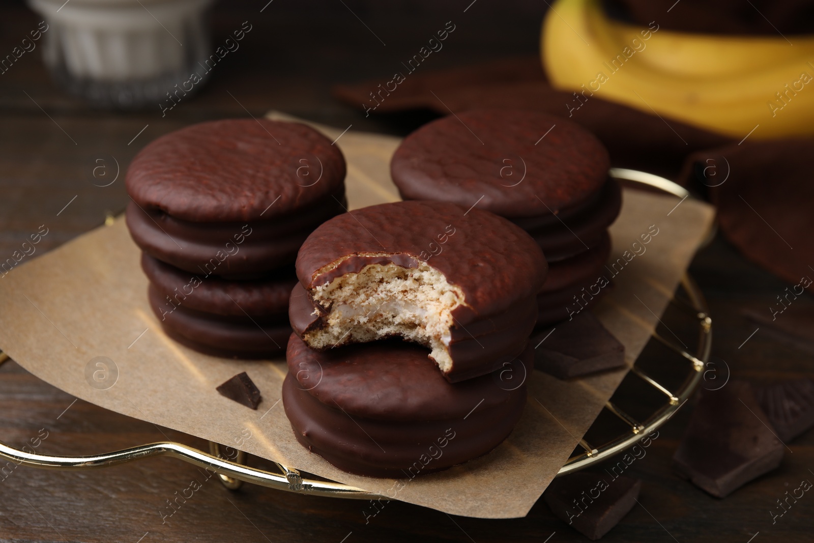 Photo of Delicious banana choco pies on table, closeup