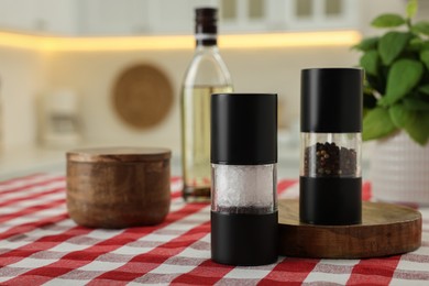Photo of Salt and pepper shakers on table indoors, space for text