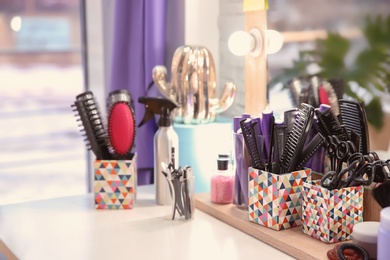 Set of hairdresser tools on table in salon