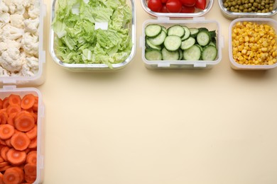 Photo of Plastic and glass containers with different fresh products on beige background, flat lay. Space for text